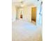 Bedroom view with soft carpet, doors to the closet and bathroom and a bright window at 3926 Castle Rock Dr, Zionsville, IN 46077