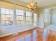 Bright dining area with hardwood floors and access to backyard deck at 3926 Castle Rock Dr, Zionsville, IN 46077