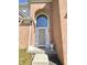 Elegant arched entryway with glass features, flanked by sconces, leading to a stylish front door at 3926 Castle Rock Dr, Zionsville, IN 46077