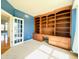 Office with built-in shelves and large window at 3926 Castle Rock Dr, Zionsville, IN 46077