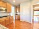 Stylish kitchen featuring granite countertops, modern appliances and hardwood floors at 3926 Castle Rock Dr, Zionsville, IN 46077