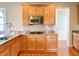 Charming kitchen with stainless steel appliances, granite countertops, and custom cabinetry at 3926 Castle Rock Dr, Zionsville, IN 46077