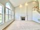 Bright living room with soaring windows, fireplace and staircase at 3926 Castle Rock Dr, Zionsville, IN 46077