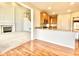 Open concept living room with fireplace flows into the kitchen and dining area at 3926 Castle Rock Dr, Zionsville, IN 46077