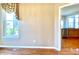 Comfortable living room with a view into the kitchen, showcasing the home's layout at 3926 Castle Rock Dr, Zionsville, IN 46077