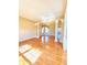 Spacious living room with hardwood floors, column accents and ample natural light at 3926 Castle Rock Dr, Zionsville, IN 46077