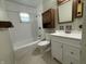 Clean bathroom featuring a shower-tub combo and updated vanity at 4121 Fletcher Ave, Indianapolis, IN 46203