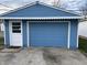 Detached blue garage with white trim at 4121 Fletcher Ave, Indianapolis, IN 46203