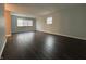 Bright living room with freshly painted walls and modern, dark, hardwood flooring at 4121 Fletcher Ave, Indianapolis, IN 46203
