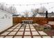 The outdoor kitchen area, patio with string lights, and wooden deck create an ideal space for gatherings at 4711 East 21St St, Indianapolis, IN 46218