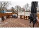 Spacious backyard with a wooden deck, grilling area, and a detached two-car garage at 4711 East 21St St, Indianapolis, IN 46218