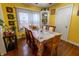 Bright dining room featuring a large window and a wooden table with seating for six at 4711 East 21St St, Indianapolis, IN 46218