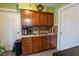 A functional kitchen space featuring a double sink, cabinets, and essential appliances at 4711 East 21St St, Indianapolis, IN 46218