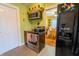 Well-lit kitchen showcasing stainless steel appliances, including a range and microwave, with a view into the dining area at 4711 East 21St St, Indianapolis, IN 46218