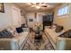 Comfortable living room with a ceiling fan, plush sofas, decorative pillows and a cozy rug at 4711 East 21St St, Indianapolis, IN 46218