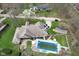 Aerial view of a home featuring a pool, patio, screened in porch and large private yard at 4808 N Camelot Dr, Muncie, IN 47304