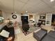 Expansive basement with recessed lighting, tiled floor, several seating areas and large TV, perfect for recreation at 4808 N Camelot Dr, Muncie, IN 47304