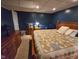 Comfortable bedroom featuring a cozy bed, dresser, and ample lighting for a relaxing retreat at 4808 N Camelot Dr, Muncie, IN 47304