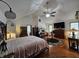Spacious bedroom with hardwood floors, vaulted ceilings, and multiple furnishings at 4808 N Camelot Dr, Muncie, IN 47304