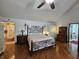 Bedroom featuring hardwood floors and an decorative wrought iron bed frame at 4808 N Camelot Dr, Muncie, IN 47304