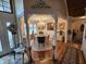 Elegant dining room features a chandelier, a round table, and decorative columns, creating a sophisticated ambiance at 4808 N Camelot Dr, Muncie, IN 47304