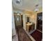 Hallway with a vanity, three chandelier style lights, and warm colored walls at 4808 N Camelot Dr, Muncie, IN 47304