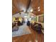 Inviting living room with natural light, wood floors, and comfortable furniture for a relaxing atmosphere at 4808 N Camelot Dr, Muncie, IN 47304