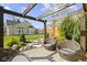 Backyard deck area with pergola, wicker chairs, and landscaping that enhances outdoor living at 490 W Walnut St, Zionsville, IN 46077