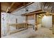 Basement with exposed ceiling and support beams at 490 W Walnut St, Zionsville, IN 46077