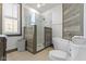 This bathroom features a glass shower, a soaking tub, and neutral tones at 490 W Walnut St, Zionsville, IN 46077