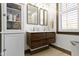 Bathroom featuring a double vanity and cabinet for ample storage at 490 W Walnut St, Zionsville, IN 46077