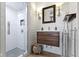 Updated bathroom with modern vanity and glass-enclosed shower stall at 490 W Walnut St, Zionsville, IN 46077