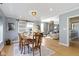 Bright dining room features light wood floors and a sliding barn door at 490 W Walnut St, Zionsville, IN 46077