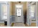 Stylish entryway with white door, decorative glass, and complementary wall colors at 490 W Walnut St, Zionsville, IN 46077