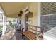 Welcoming porch with cozy seating, modern lighting, and classic architectural details at 490 W Walnut St, Zionsville, IN 46077