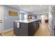 Kitchen island overlooking the dining room, with seating and ample storage at 490 W Walnut St, Zionsville, IN 46077