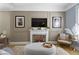 Living room with fireplace, stylish decor, and large windows for natural light at 490 W Walnut St, Zionsville, IN 46077