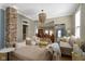 Spacious living room featuring an eye-catching chandelier and beautiful furnishings at 490 W Walnut St, Zionsville, IN 46077
