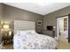 Main bedroom featuring a king-size bed, dresser, and ensuite bathroom at 490 W Walnut St, Zionsville, IN 46077