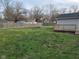 Large backyard with a wooden fence, deck, and plenty of space for outdoor activities at 509 N Home Ave, Mooresville, IN 46158