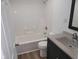 Bathroom features modern vanity with sink, tub with shower, and updated fixtures at 509 N Home Ave, Mooresville, IN 46158