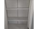 Inside the closet, you can see shelving on a bracket system inside at 509 N Home Ave, Mooresville, IN 46158