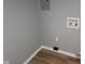 The laundry room has painted gray walls, modern vinyl flooring, and utility hookups at 509 N Home Ave, Mooresville, IN 46158