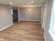 Bright and airy living room with fresh paint, recessed lighting, and modern laminate flooring at 509 N Home Ave, Mooresville, IN 46158