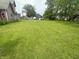 Large backyard with green grass and room for outdoor activities and entertainment at 554 N Tacoma Ave, Indianapolis, IN 46201