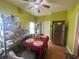 Eat-in kitchen featuring stainless steel appliances, light green walls, laminate wood flooring, and open shelving at 554 N Tacoma Ave, Indianapolis, IN 46201