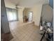 Unfurnished room showcasing tile floors, a ceiling fan, and bright windows, offering a blank canvas for design at 554 N Tacoma Ave, Indianapolis, IN 46201