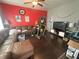 Comfortable living room featuring a large sectional sofa, ceiling fan and hardwood floors at 554 N Tacoma Ave, Indianapolis, IN 46201