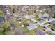 Wide aerial view of a residential area with well-maintained homes, green spaces, and a serene pond at 6124 Dry Den Ct, Indianapolis, IN 46221