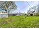 A spacious, grassy backyard and house with gray siding at 6124 Dry Den Ct, Indianapolis, IN 46221